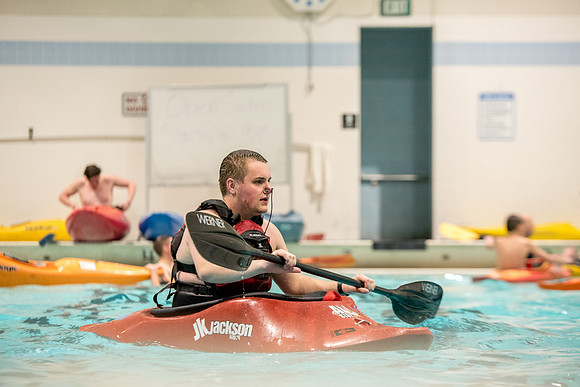 Students for a weekly gathering in the Hart pool to practice kayaking.
