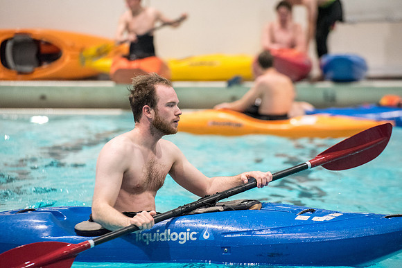 Students for a weekly gathering in the Hart pool to practice kayaking.