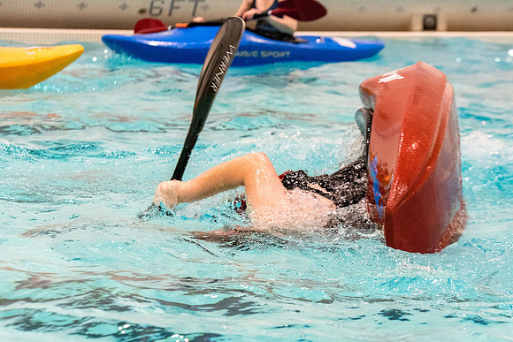 Students for a weekly gathering in the Hart pool to practice kayaking.