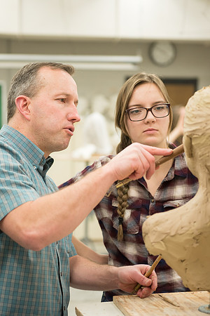 Students making head sculpture at a class taught by Brother Kody Keller