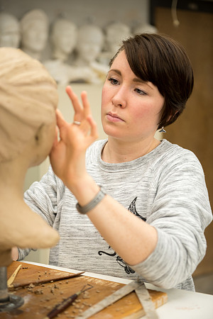 Students making head sculpture at a class taught by Brother Kody Keller