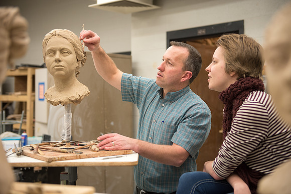 Students making head sculpture at a class taught by Brother Kody Keller