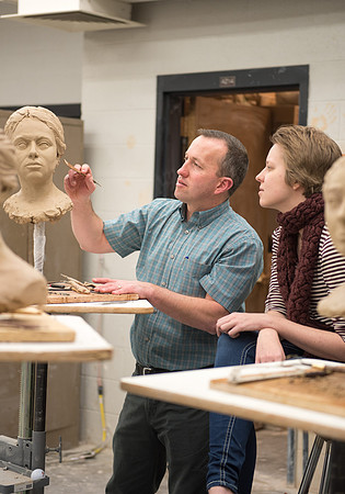 Students making head sculpture at a class taught by Brother Kody Keller