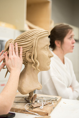 Students making head sculpture at a class taught by Brother Kody Keller
