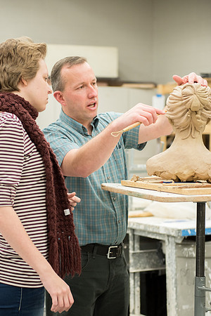Students making head sculpture at a class taught by Brother Kody Keller