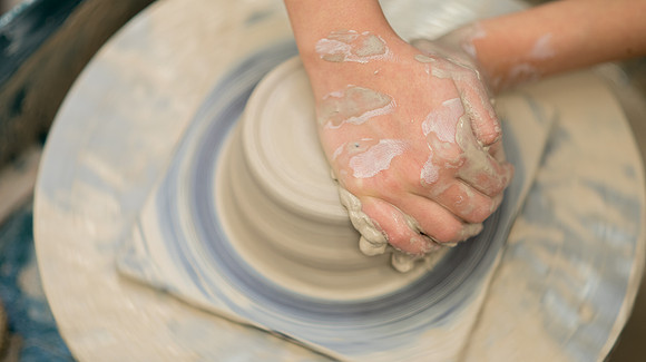 Students work on their clay projects in beginning ceramics class.