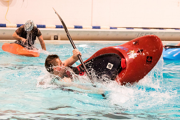 Students for a weekly gathering in the Hart pool to practice kayaking.