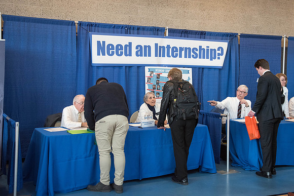 Booths fill the I-Center Courts where Businesses and Graduate Schools wait to meet with BYU-I students at the Career Fair.