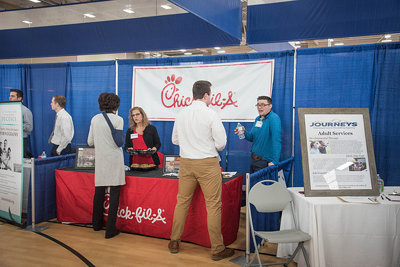 Booths fill the I-Center Courts where Businesses and Graduate Schools wait to meet with BYU-I students at the Career Fair.