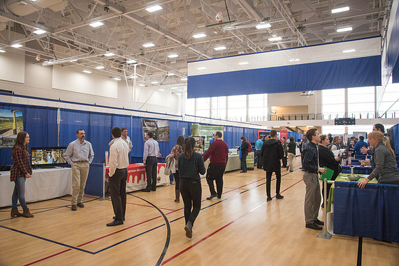 Booths fill the I-Center Courts where Businesses and Graduate Schools wait to meet with BYU-I students at the Career Fair.