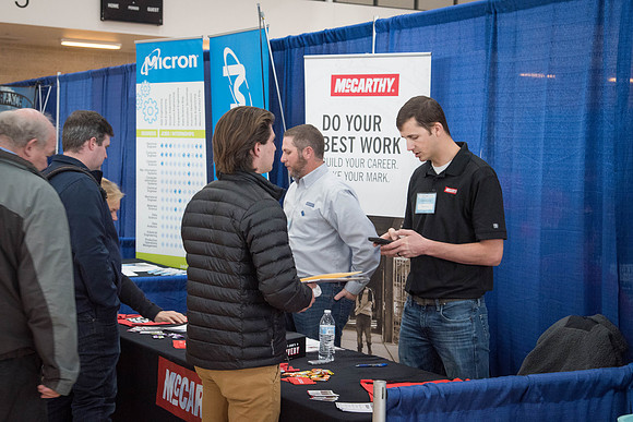 Booths fill the I-Center Courts where Businesses and Graduate Schools wait to meet with BYU-I students at the Career Fair.