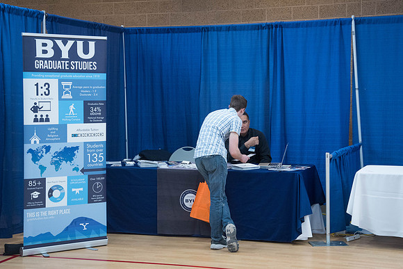 Booths fill the I-Center Courts where Businesses and Graduate Schools wait to meet with BYU-I students at the Career Fair.