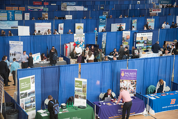 Booths fill the I-Center Courts where Businesses and Graduate Schools wait to meet with BYU-I students at the Career Fair.
