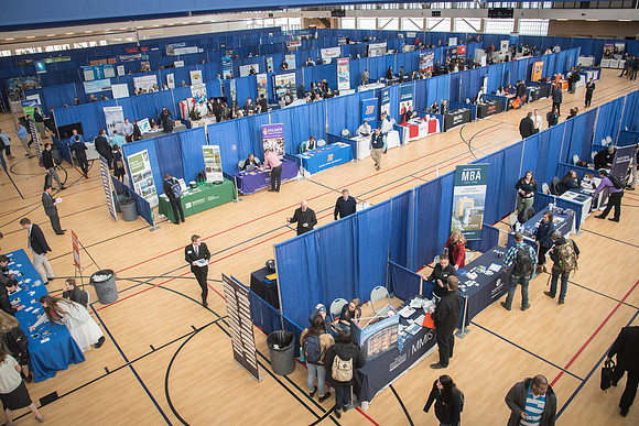 Booths fill the I-Center Courts where Businesses and Graduate Schools wait to meet with BYU-I students at the Career Fair.