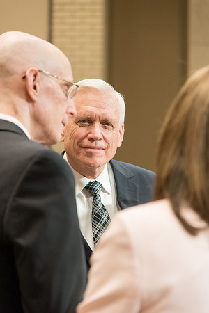 Brother Marriott talking to President and Sister Eyring.