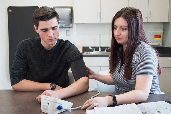 A BYU-Idaho Wellness Center student employee coaching other student to achieve their goals towards health and wellness. Feb 2018