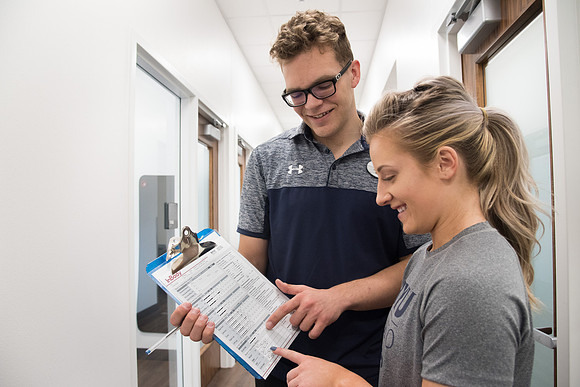 A BYU-Idaho Wellness Center student employee coaching other student to achieve their goals towards health and wellness. Feb 2018