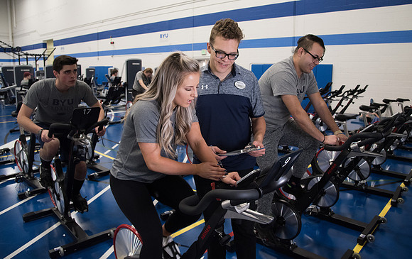 A BYU-Idaho Wellness Center student employee coaching other student to achieve their goals towards health and wellness. Feb 2018