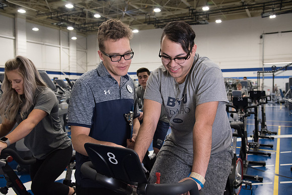 A BYU-Idaho Wellness Center student employee coaching other student to achieve their goals towards health and wellness. Feb 2018