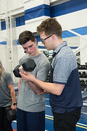 A BYU-Idaho Wellness Center student employee coaching other student to achieve their goals towards health and wellness. Feb 2018