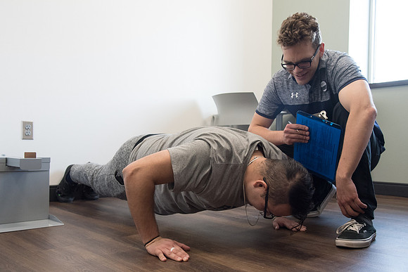 A BYU-Idaho Wellness Center student employee coaching other student to achieve their goals towards health and wellness. Feb 2018