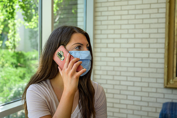Student volunteers show the way to stay safe during this COVID 19 pandemic by social distancing, following pathway arrows and proper wearing of masks .