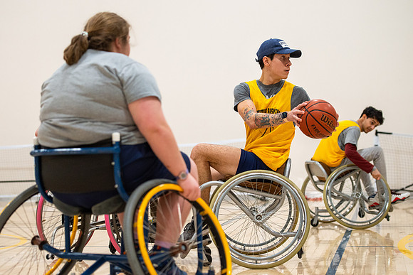 Students participate of Wheelchair Basketball in the Hart Gym.