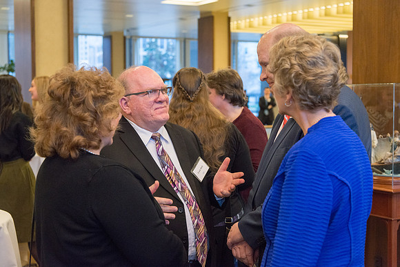 Guests have a chance to mingle during an evening with President Henry J. Eyring in the Church Office Building in Salt Lake City, Utah.