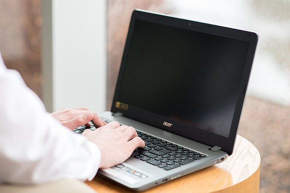 Online student using laptop computer.