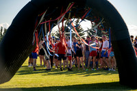 Students gather at the upper field for various 4th of July activities.