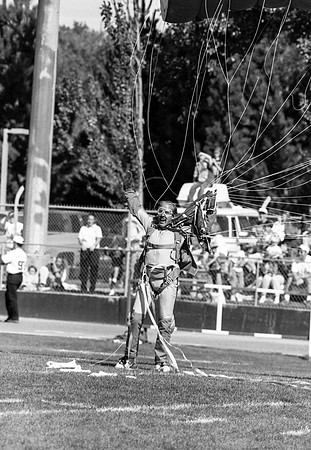 Homecoming football game, parachuter.