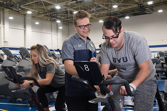 A BYU-Idaho Welness Center student employee coaching other student to achieve their goals towards health and wellness. Feb 2018