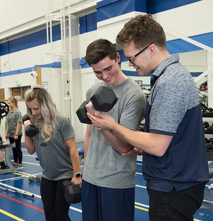 A BYU-Idaho Welness Center student employee coaching other student to achieve their goals towards health and wellness. Feb 2018