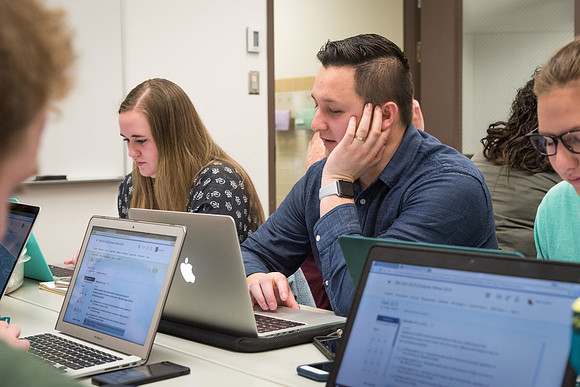Students study with Brother John Fisher in the Biology Study Lab.