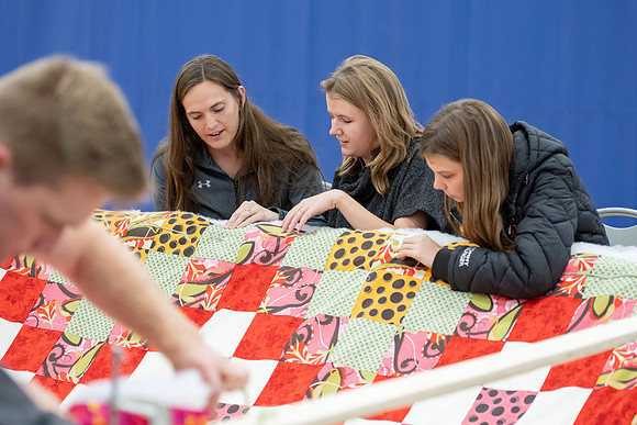 Students gather in the I-Center courts for a service project during spirit week.
