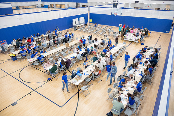 Students gather in the I-Center courts for a service project during spirit week.