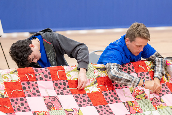 Students gather in the I-Center courts for a service project during spirit week.