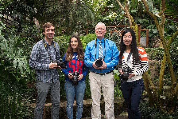Mike Lewis and students Ericka Sanders, Cami Su, and Garrett Blanchard pose a photo in the Benson Greenhouse at the end of a great semester.