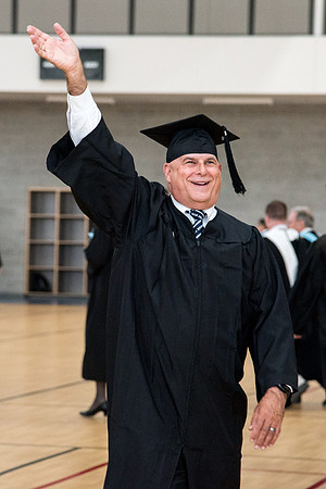 Graduates meet in the I-Center Courts for Processional.
