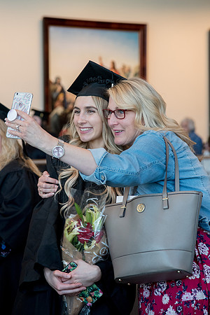 BYU-Idaho graduates with their family and friends after the commencement service at the BYU-Idaho Center.