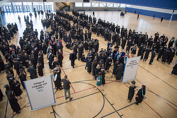 Graduates standing in Line Commencement