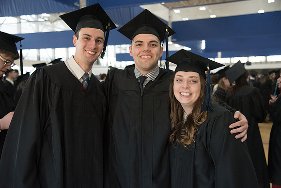 Allison with husband and friend Commencement