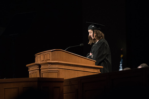 BYU-Idaho Winter Semester Graduation. A graduate praying during Commencement. Apr 2018