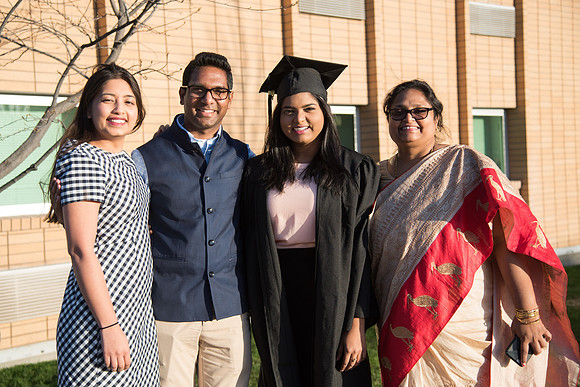 BYU-Idaho Winter Semester Graduation. A graduate posing with her family. Apr 2018