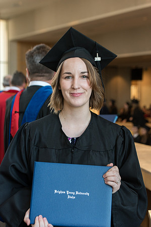 BYU-Idaho students graduate from College of Eduation and Human Development convocation receive their diplomas.