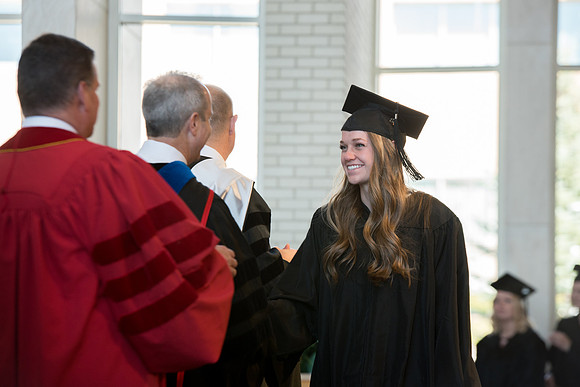 BYU-Idaho students graduate from College of Eduation and Human Development convocation receive their diplomas.