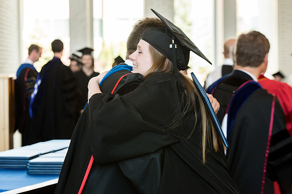 BYU-Idaho students graduate from College of Eduation and Human Development convocation receive their diplomas.