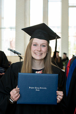 BYU-Idaho students graduate from College of Eduation and Human Development convocation receive their diplomas.