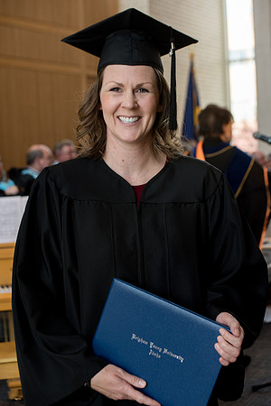 BYU-Idaho students graduate from College of Eduation and Human Development convocation receive their diplomas.