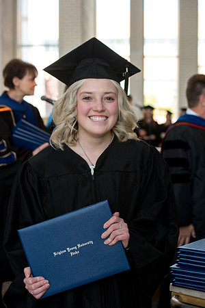 BYU-Idaho students graduate from College of Eduation and Human Development convocation receive their diplomas.